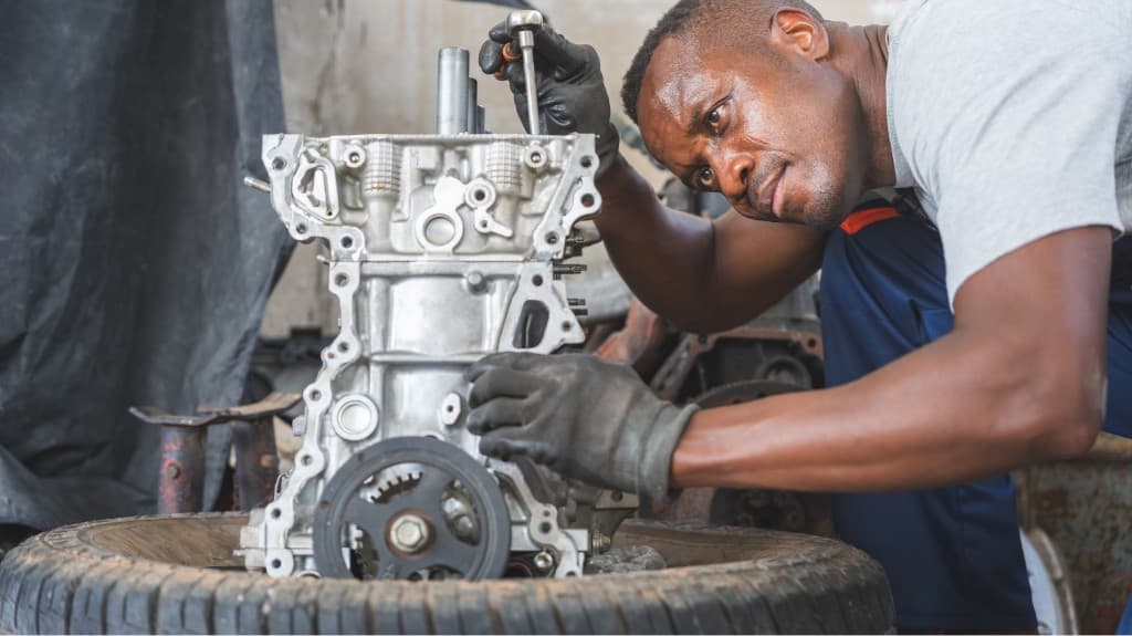 Mechanic assembling an engine block